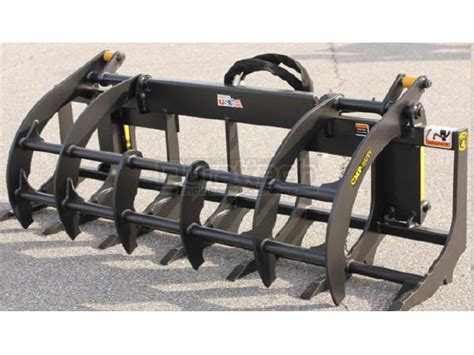 skid steer with root grapple|60 inch root rake grapple.